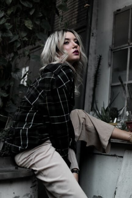 pexels-photo-3124332-3124332-1 Stylish woman in plaid shirt poses in urban setting, showcasing modern fashion and style.