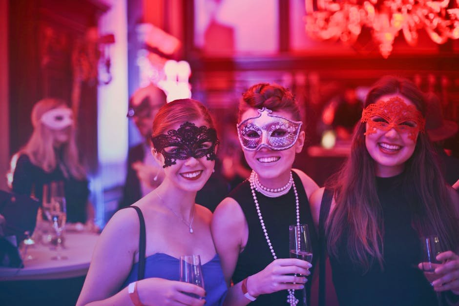 pexels-photo-787961-787961-1 A vibrant masquerade party with happy guests wearing decorative masks and holding champagne glasses.